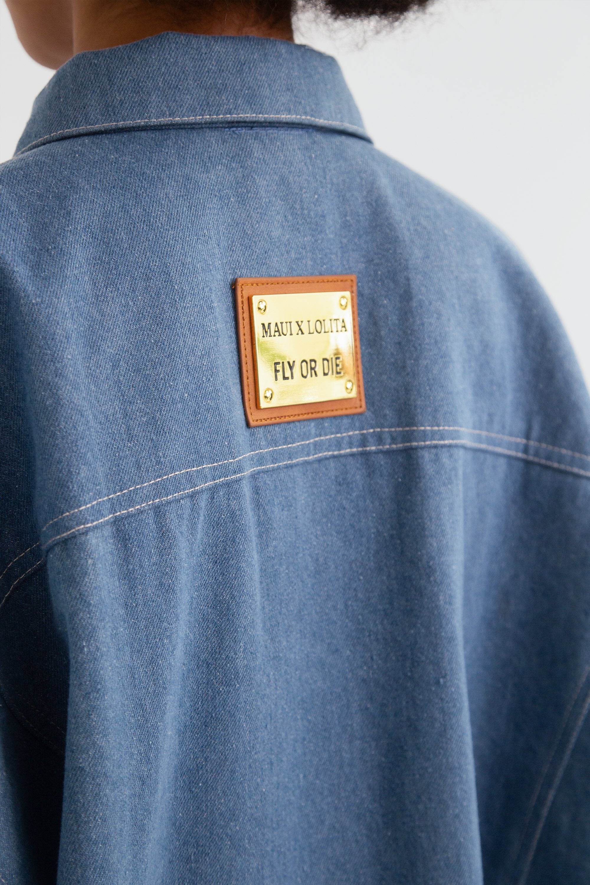 Close up of the brand label on the back of a denim jacket