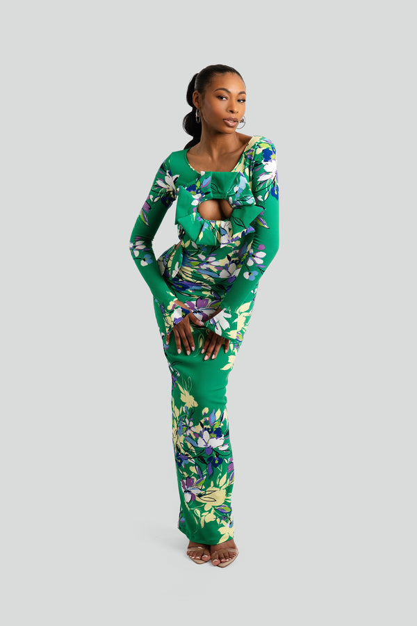 Floor-length floral print dress designed with a sleek body-shaping silhouette, sharp flared cuffs, and a smooth cascading hemline