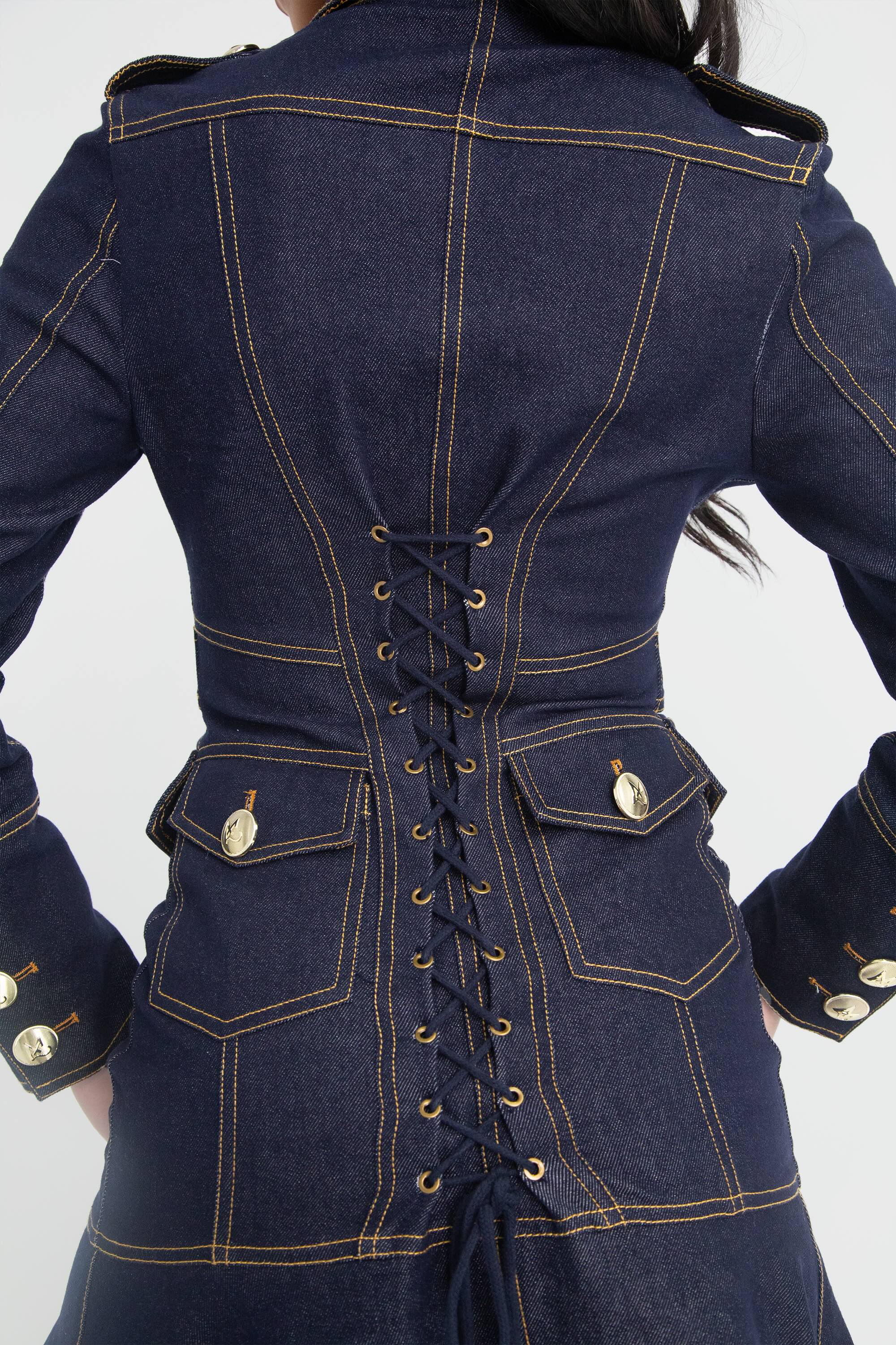 Back view of a dark blue denim dress with corset lacing and gold buttons