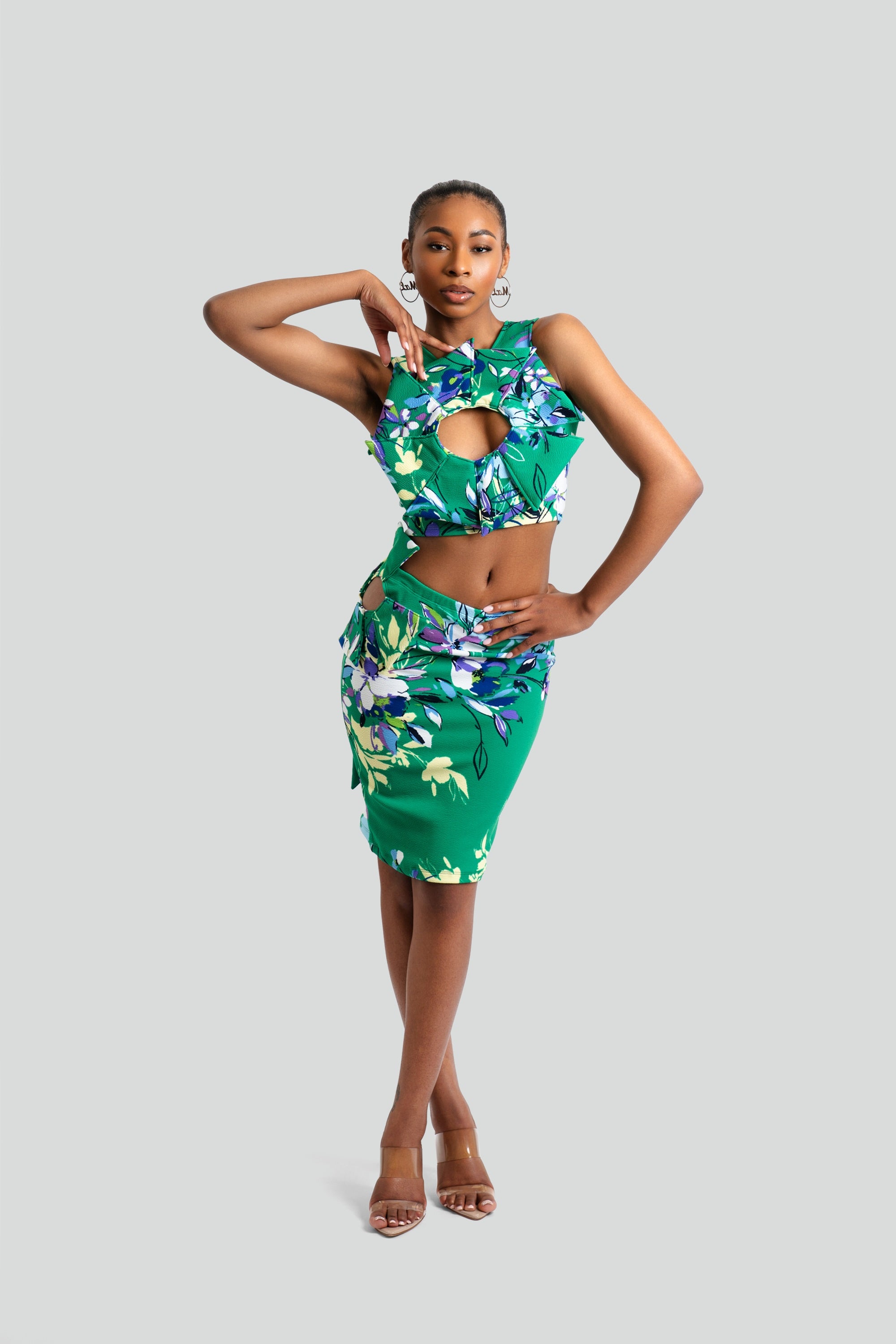 Woman wearing a Maui by Lolita green floral print maxi skirt set with a sleeveless keyhole halter top