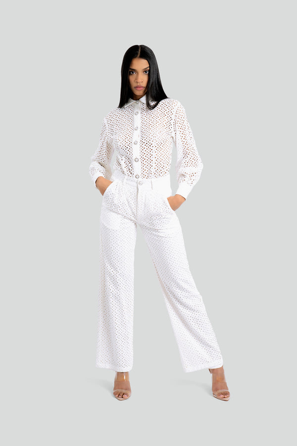 Model wearing the Maui X Lolita Florence white eyelet lace coordinate set styled as a luxury summer outfit with silver button accents