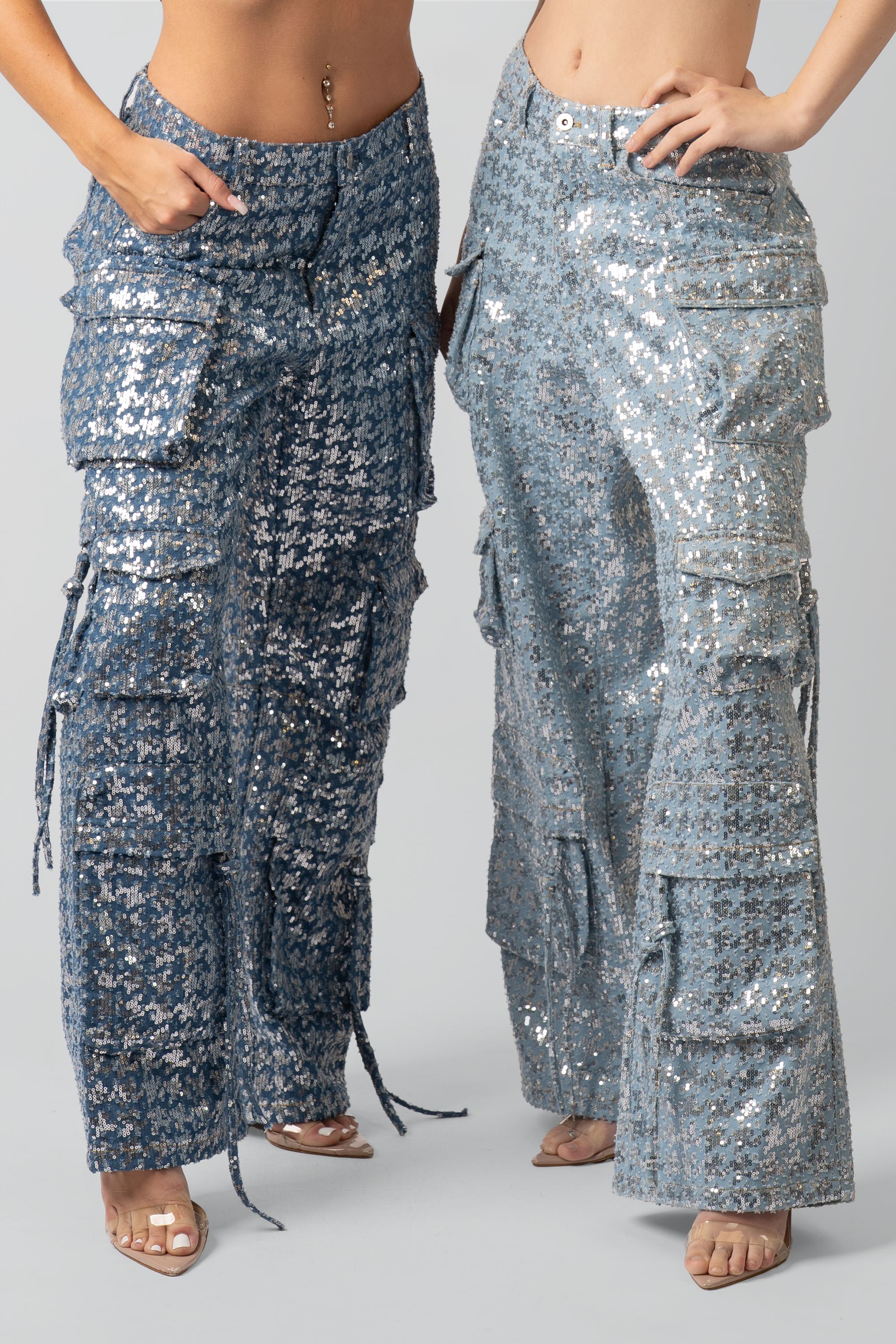 Two pairs of sequin cargo pants on a plain background