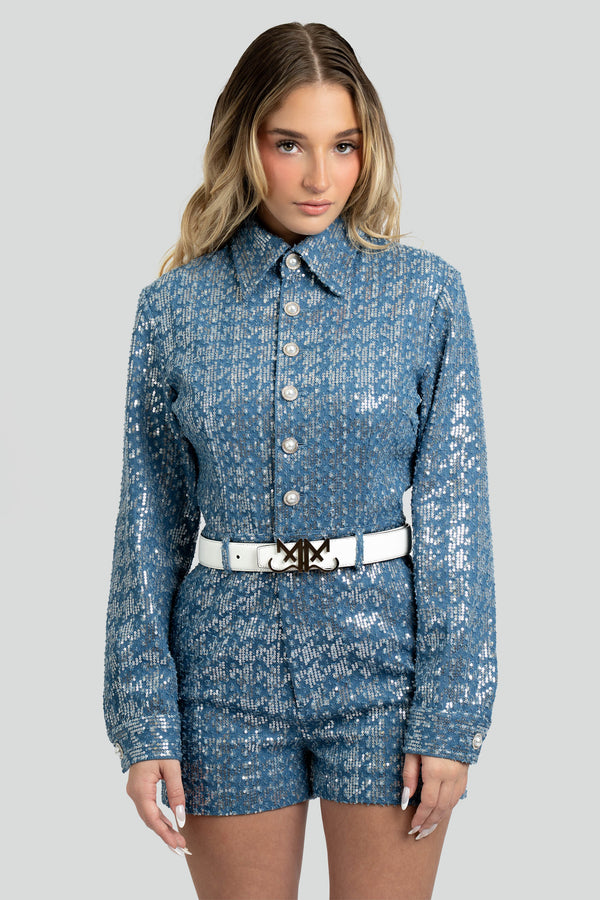 Tailored long-sleeve short romper made from structured blue jacquard denim entirely layered with shimmering silver sequins