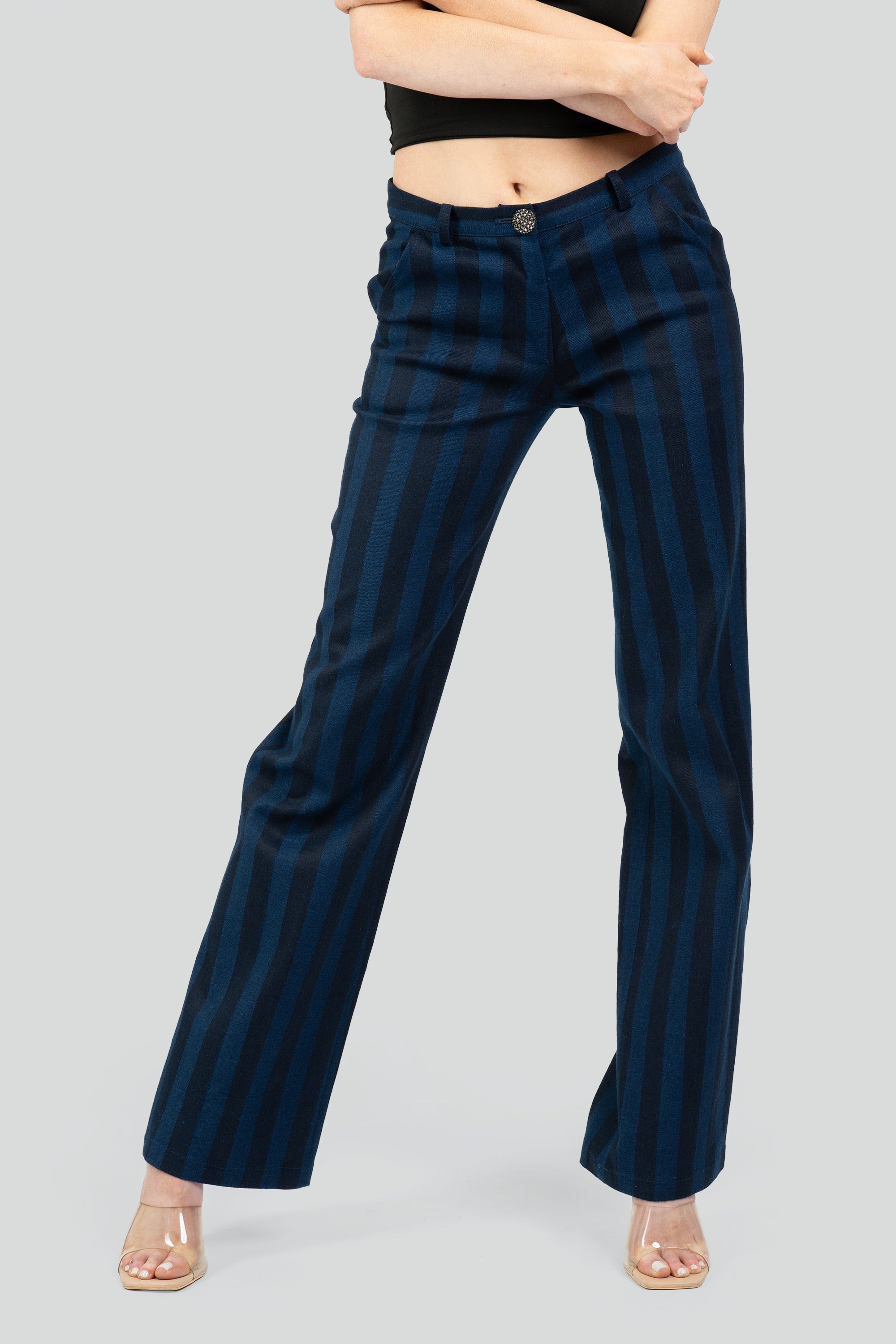 Close up of navy striped pants on a white background